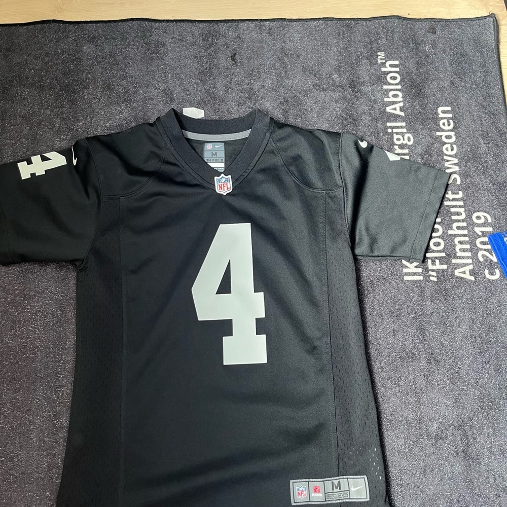 im selling a black raiders jersey